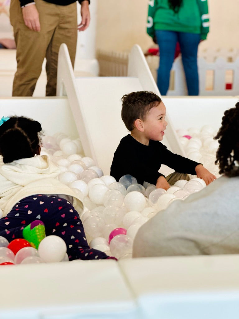 Kids playing in toddler slide and ball pit rental in Atlanta