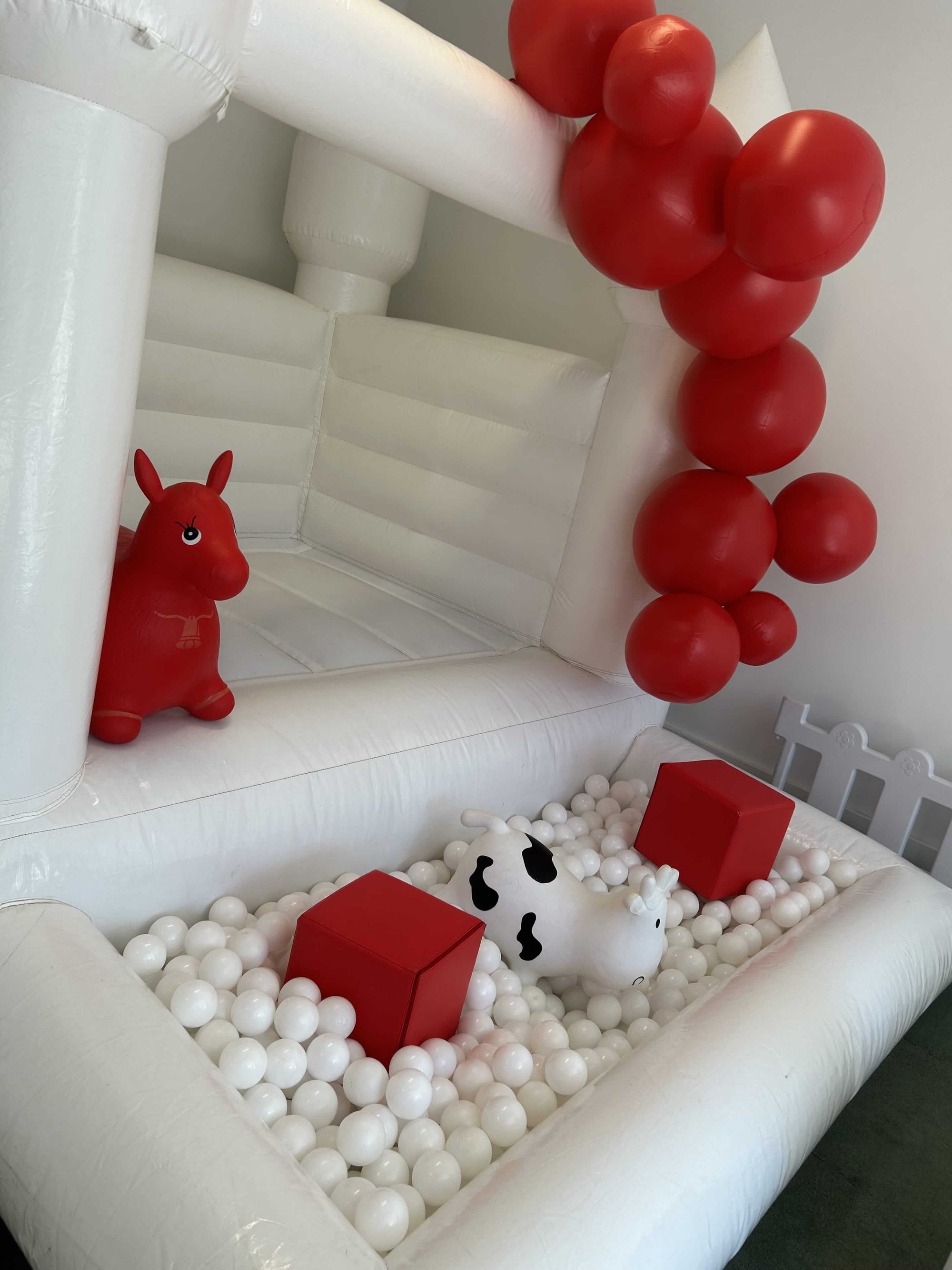 Mini White Bounce House and Soft Play Rental Atlanta with Red Theme | Confetti Jar