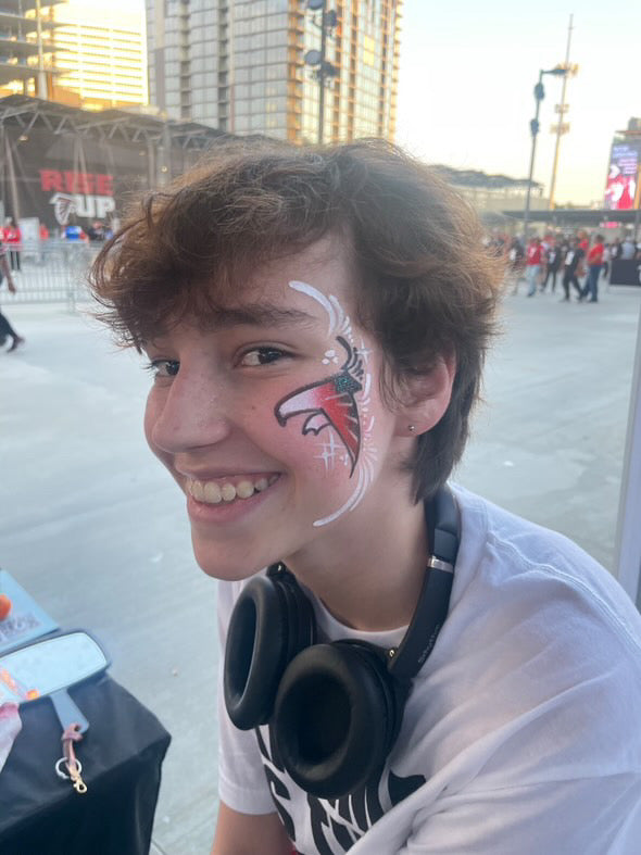 Boy with Falcons Face Painting Atlanta | Confetti Jar